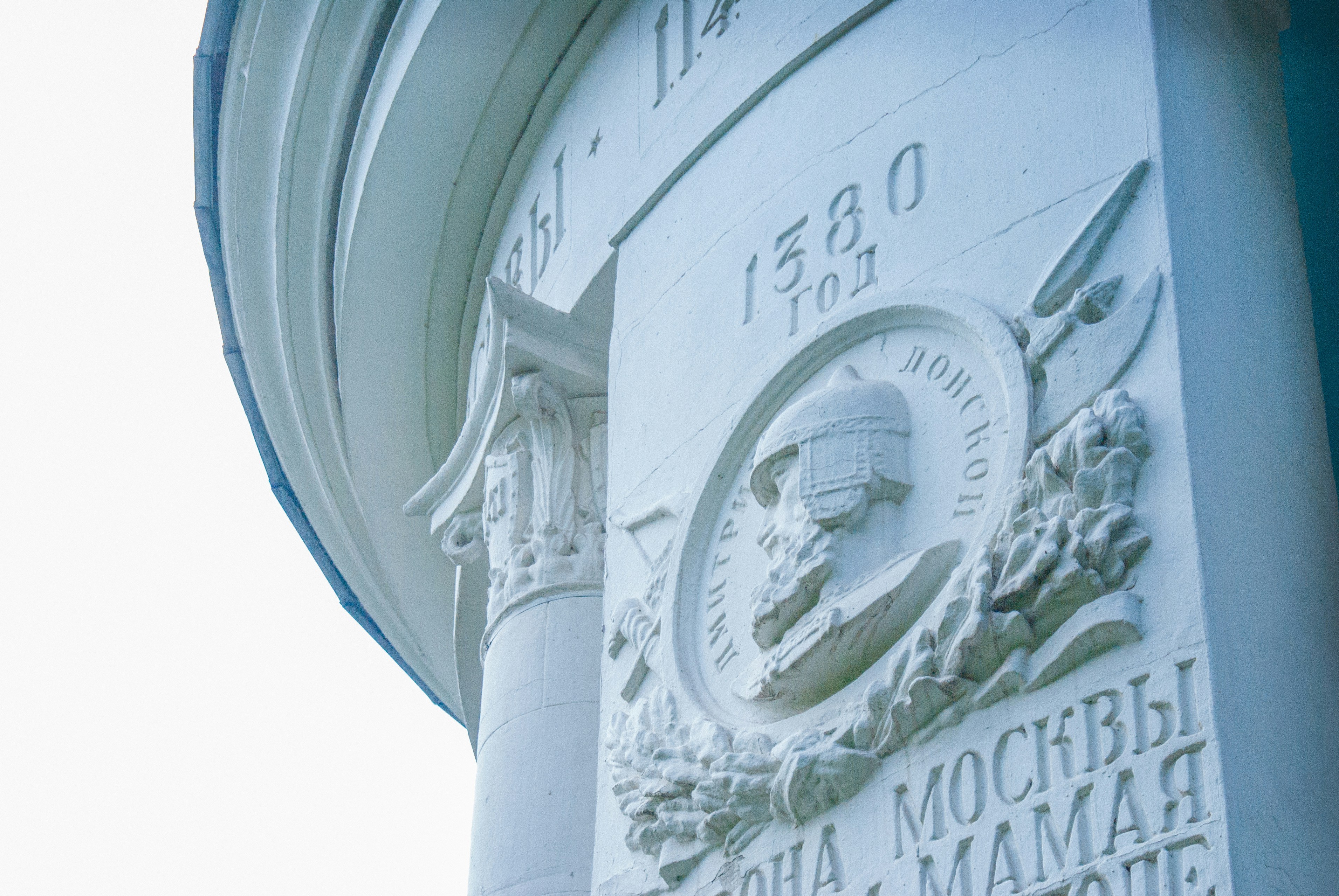 A close up of a clock on a building