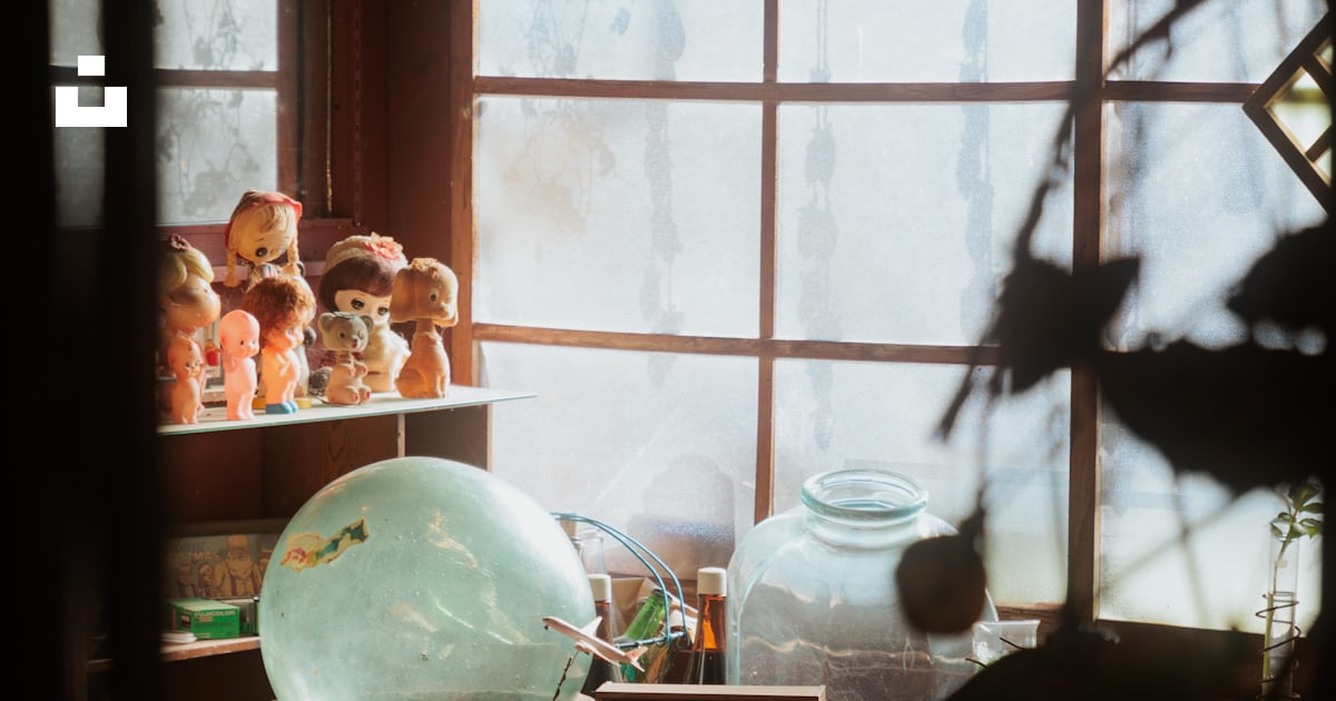 A room filled with lots of clutter next to a window photo – Free Cafe ...