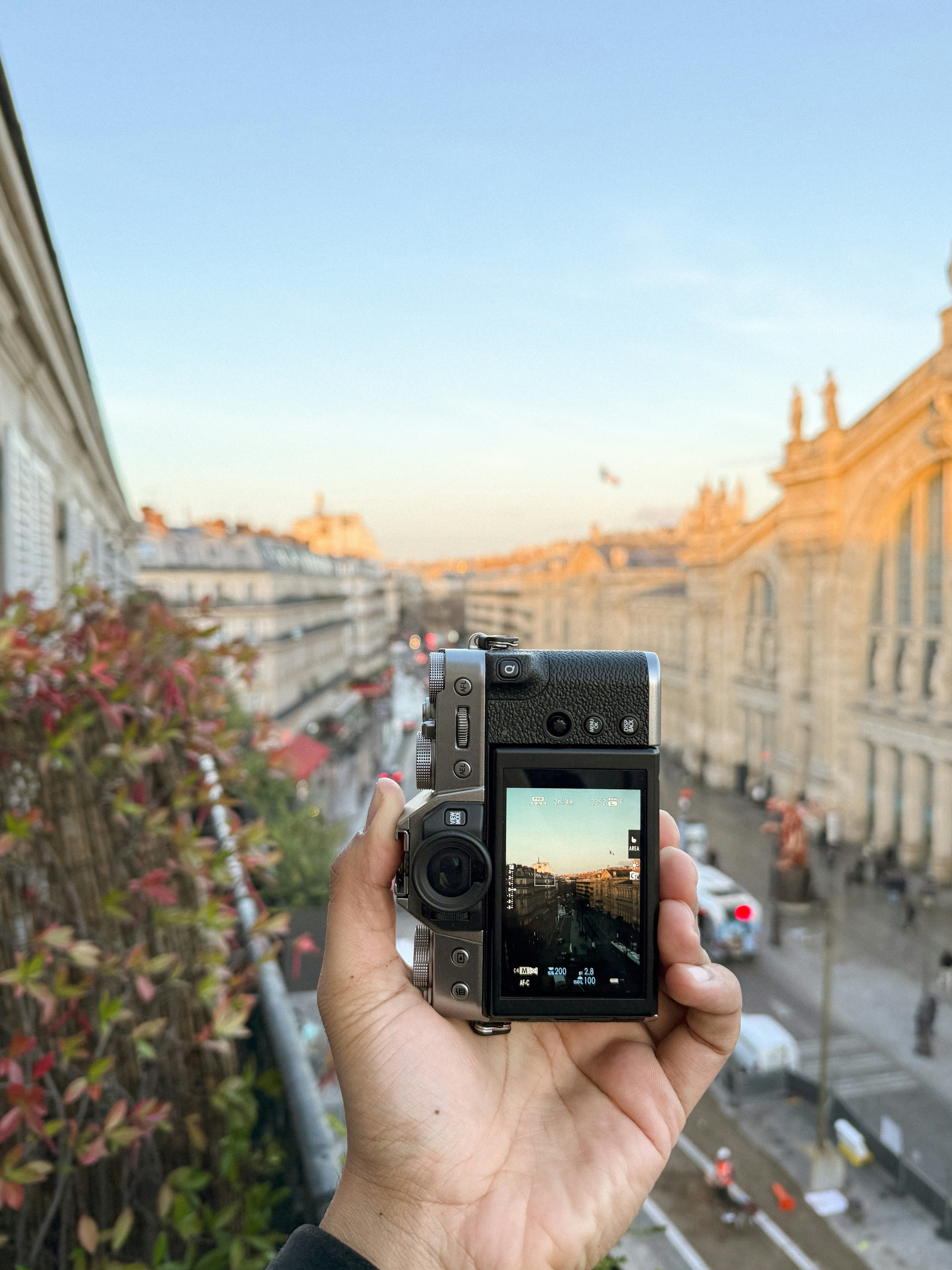 A person taking a picture of a city street