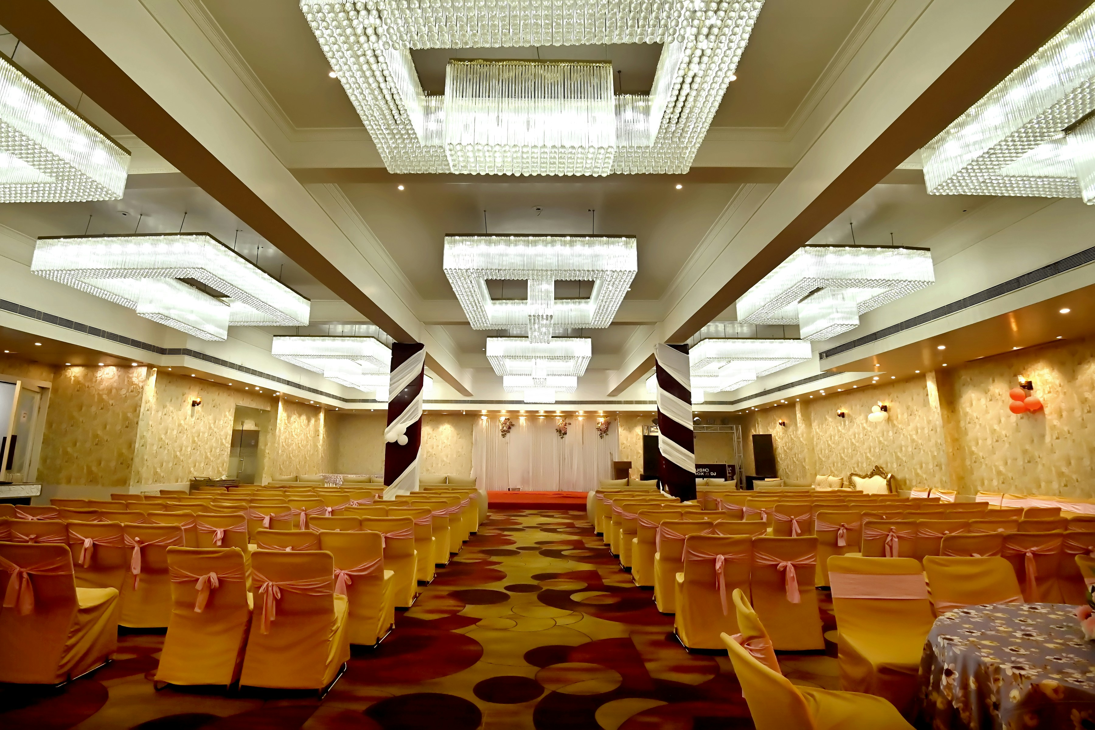 A large room with rows of tables and chairs