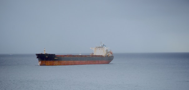 A large cargo ship in the middle of the ocean
