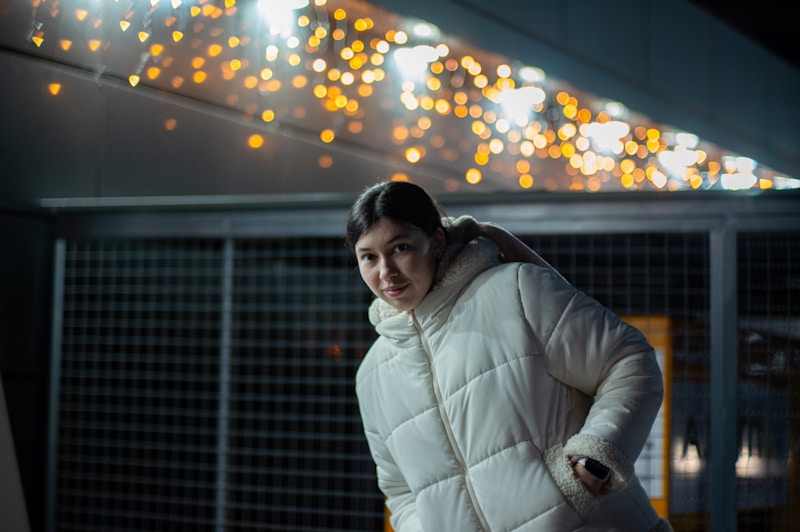 Confident woman in white jacket urban setting
