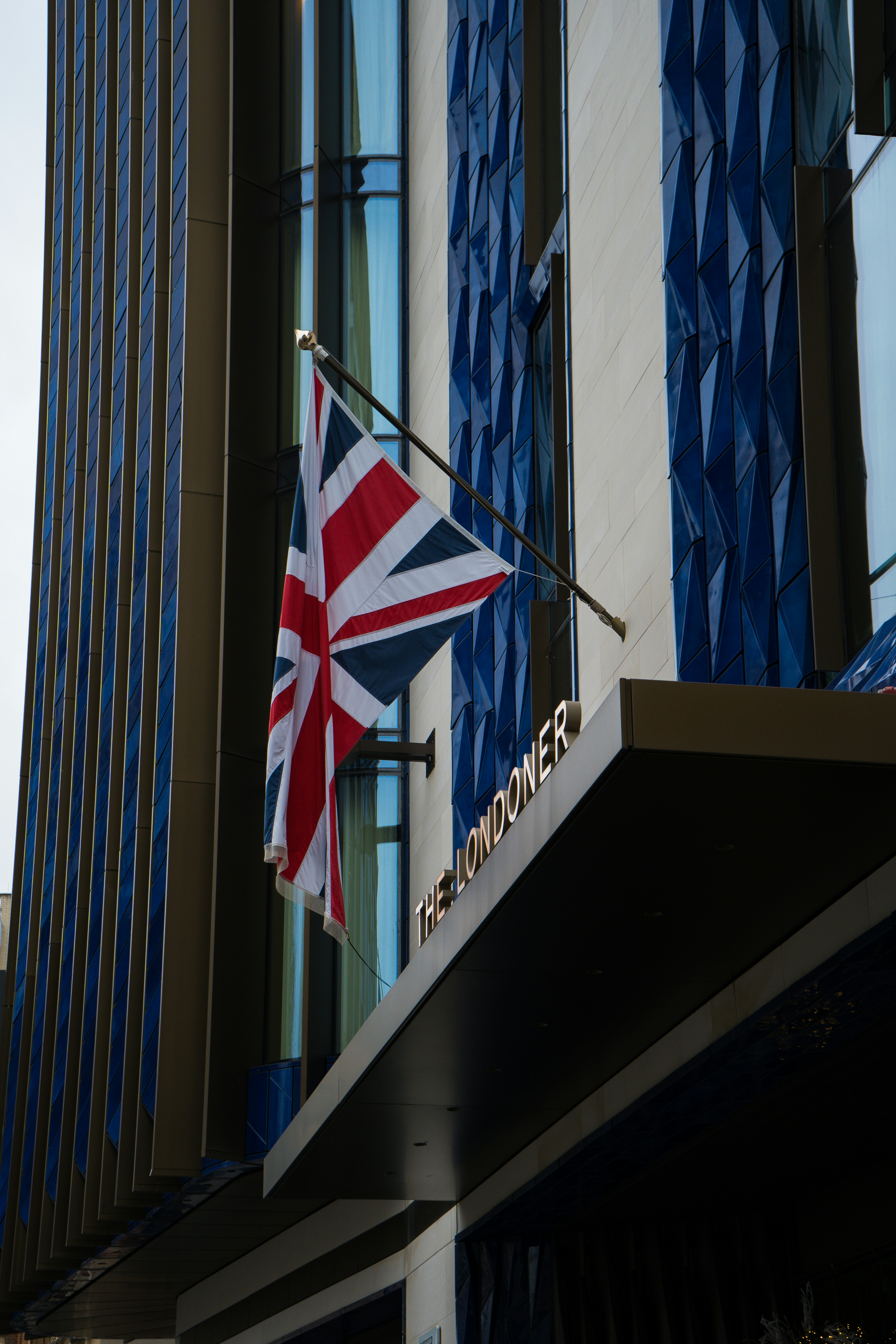 A building with a flag hanging from the side of it