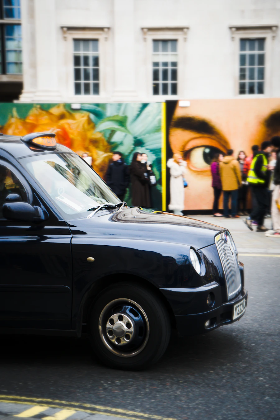Black London hackney carriage taxi on a city street