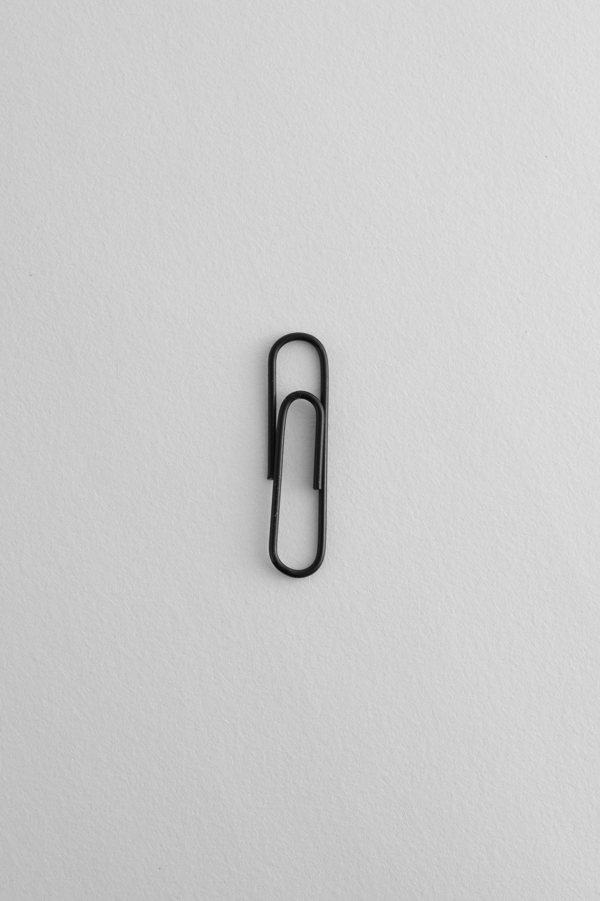 A black and white photo of a paper clip
