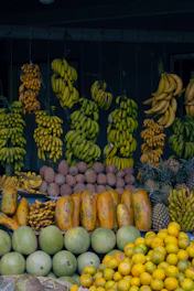 A fruit stand with many different types of fruit