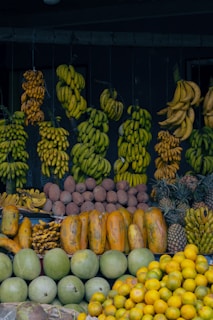 A fruit stand with many different types of fruit