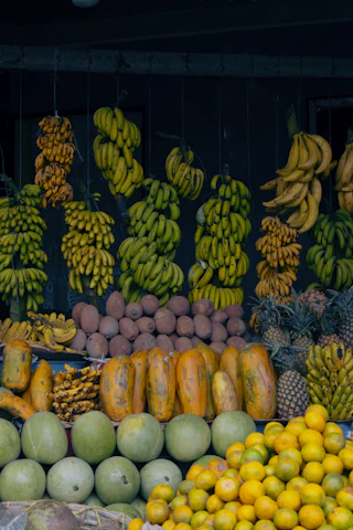 A fruit stand with many different types of fruit
