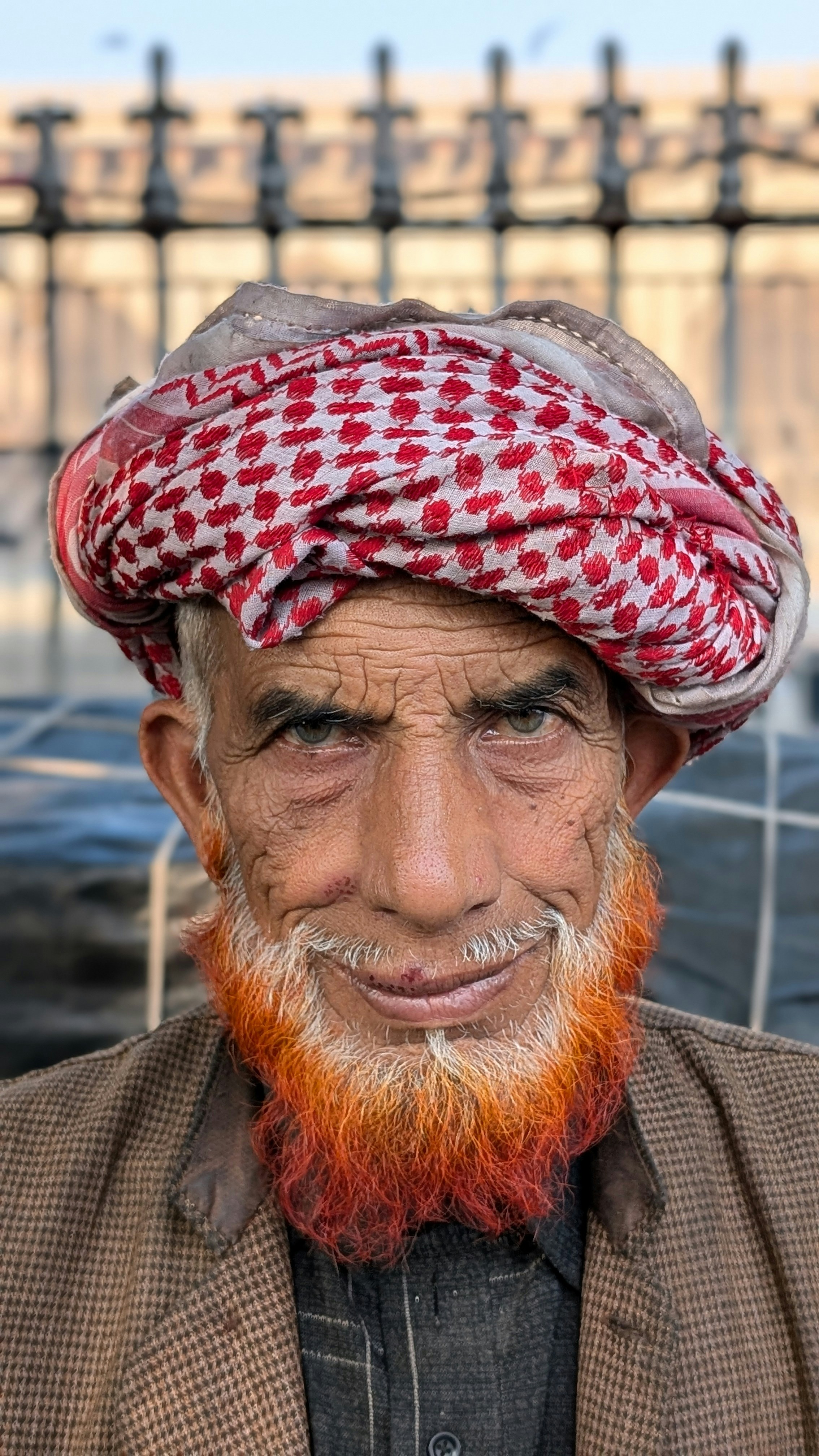 Friendly headshot of a man in his 60s, commercial property manager.