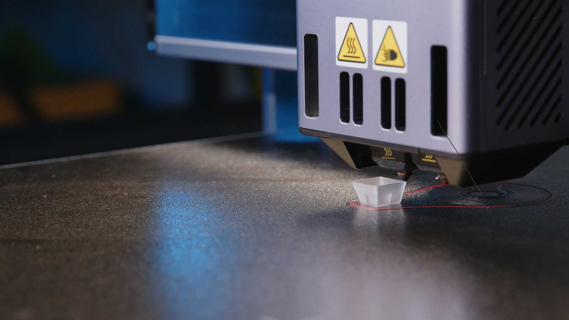 A close up of a machine that is cutting something