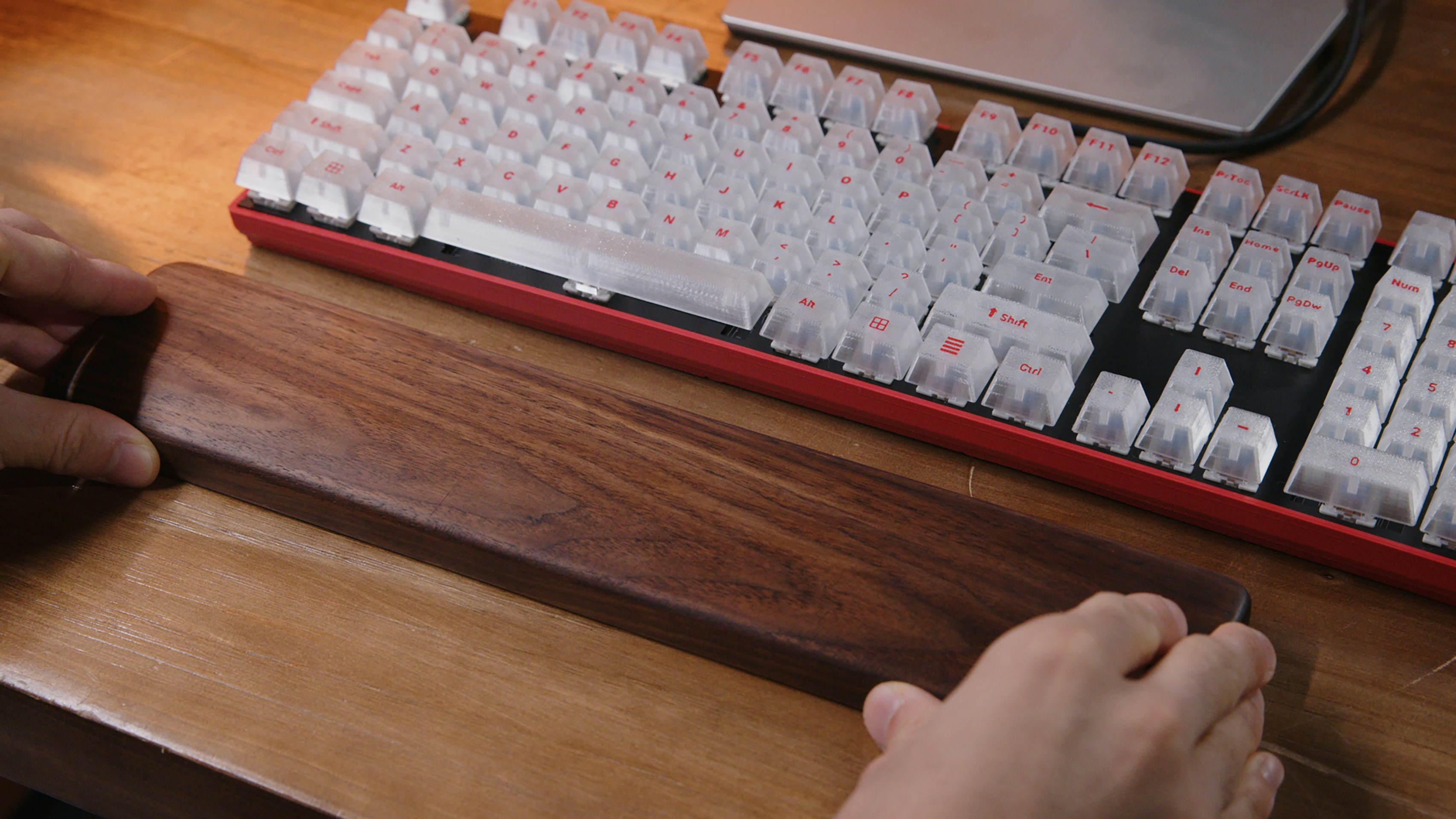 A person is typing on a computer keyboard