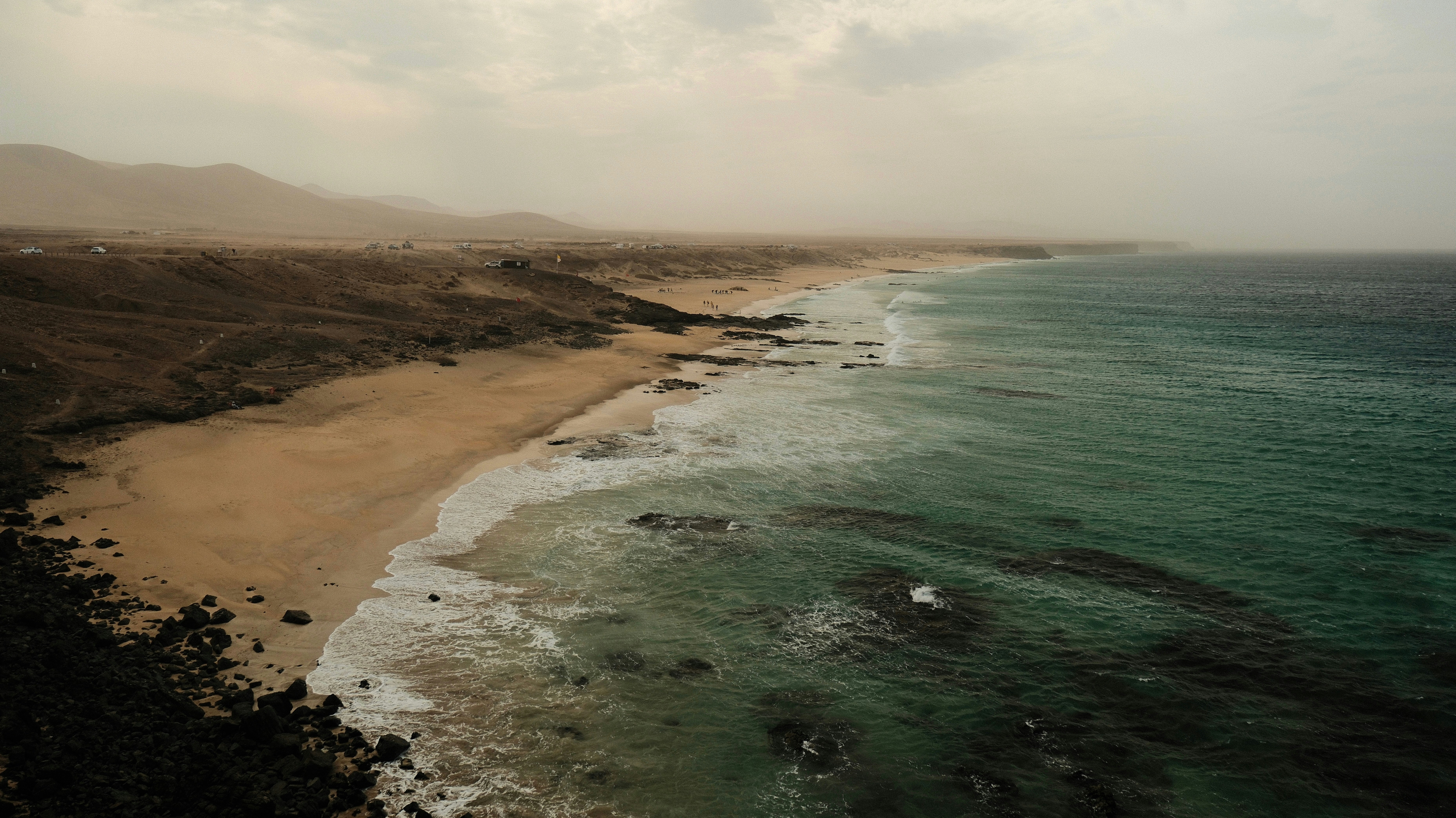 An aerial view of a beach and a body of water