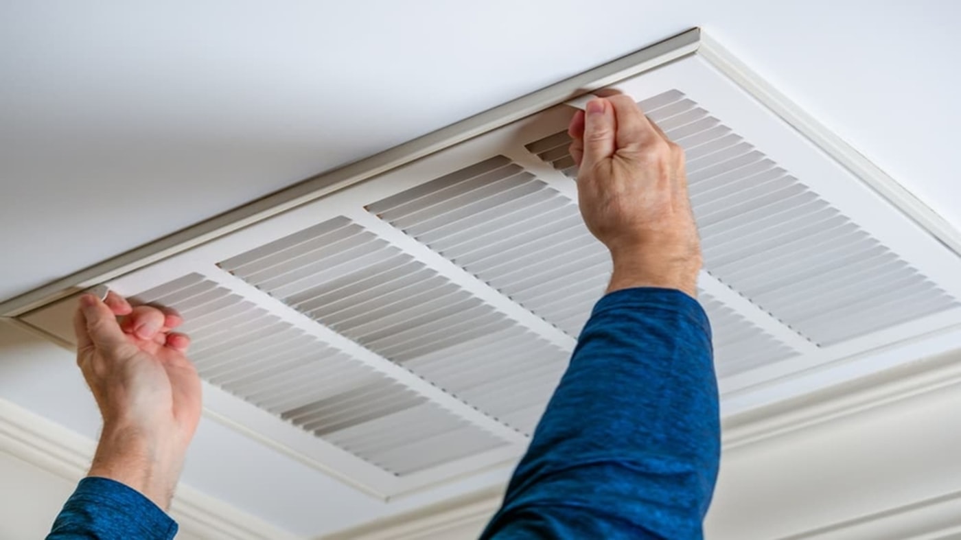 Air duct system being cleaned in a residential home