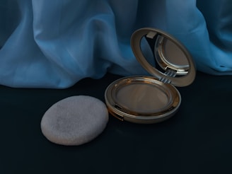 A compact mirror sitting on top of a table