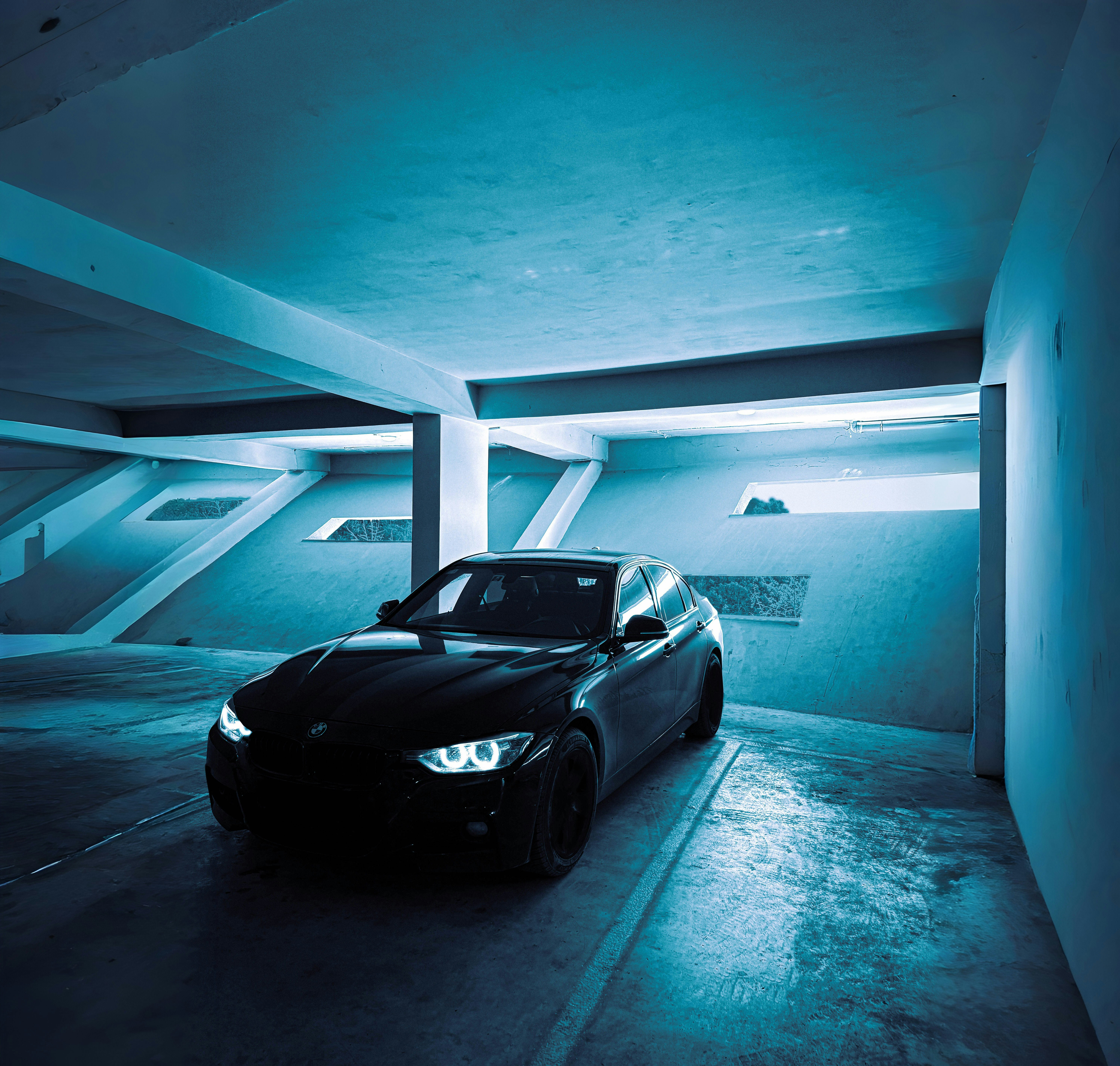 A car is parked in a parking garage