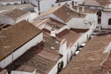 An aerial view of a city with rooftops and buildings