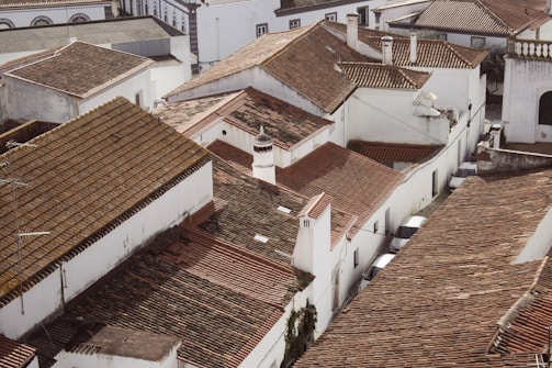 An aerial view of a city with rooftops and buildings