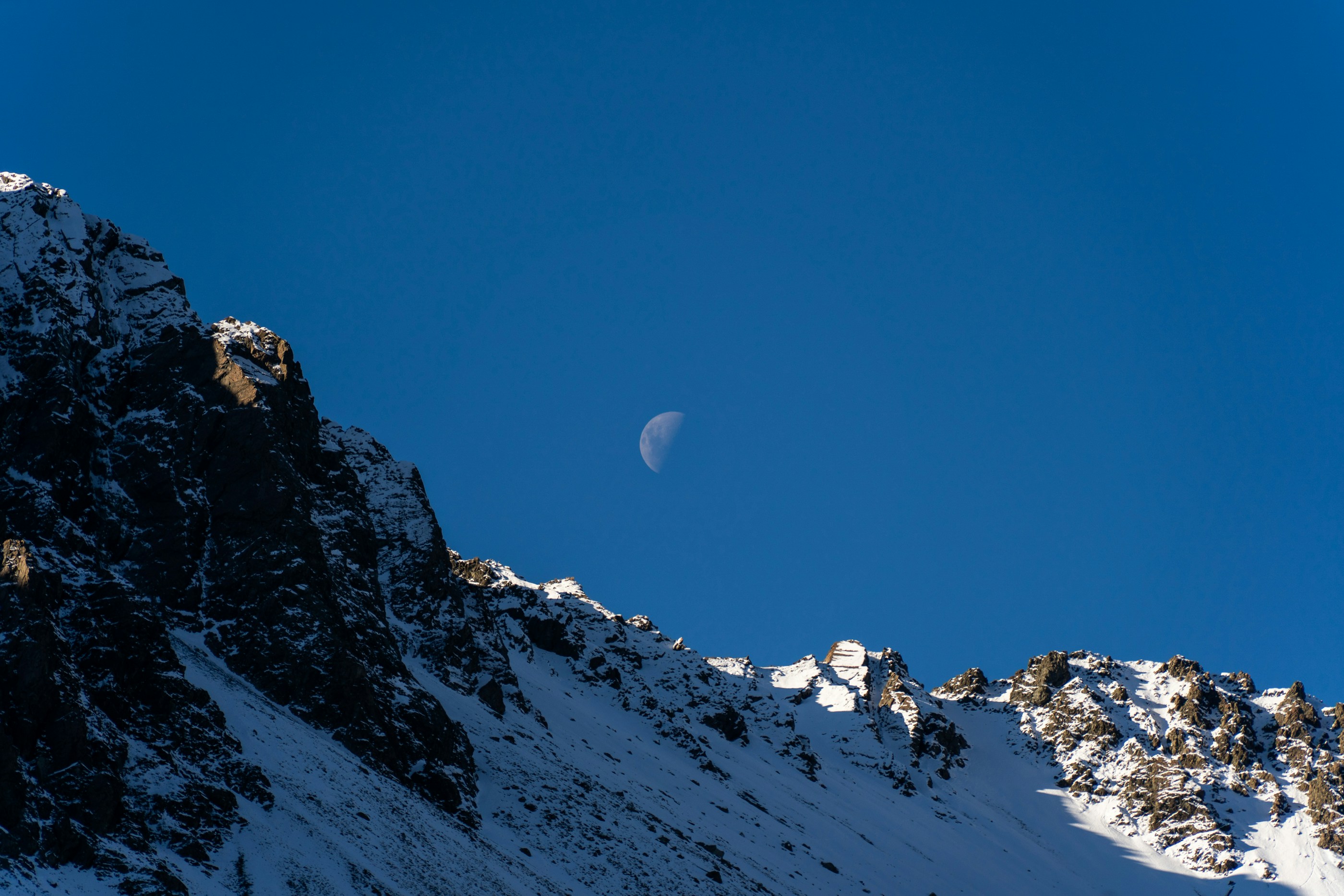 A person skiing down a snow covered mountain