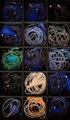 A box filled with lots of different colored cords