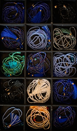 A box filled with lots of different colored cords
