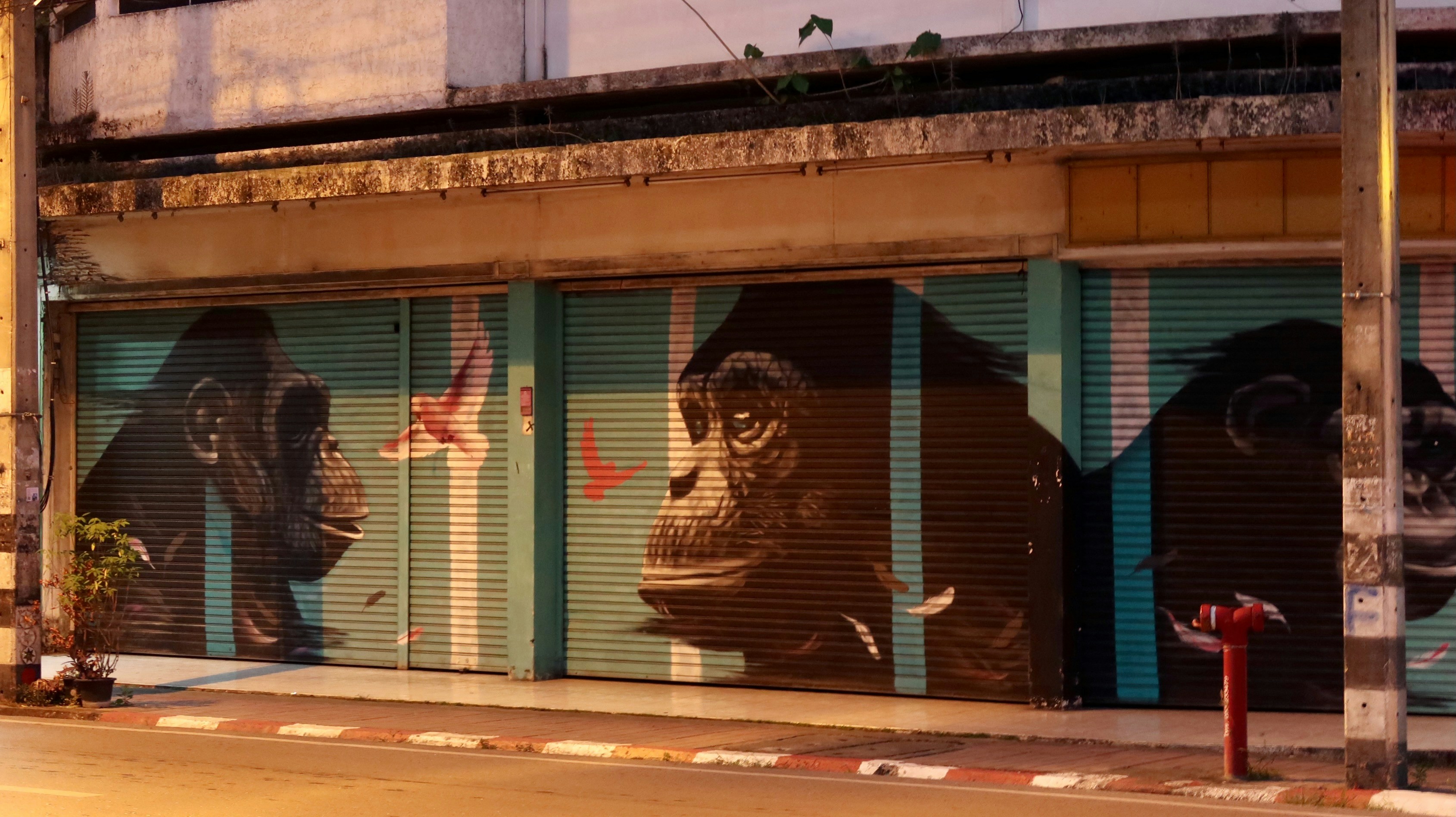 A building with a mural of gorillas on the side of it