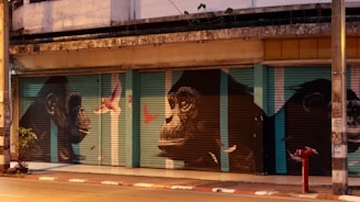 A building with a mural of gorillas on the side of it