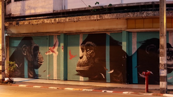 A building with a mural of gorillas on the side of it