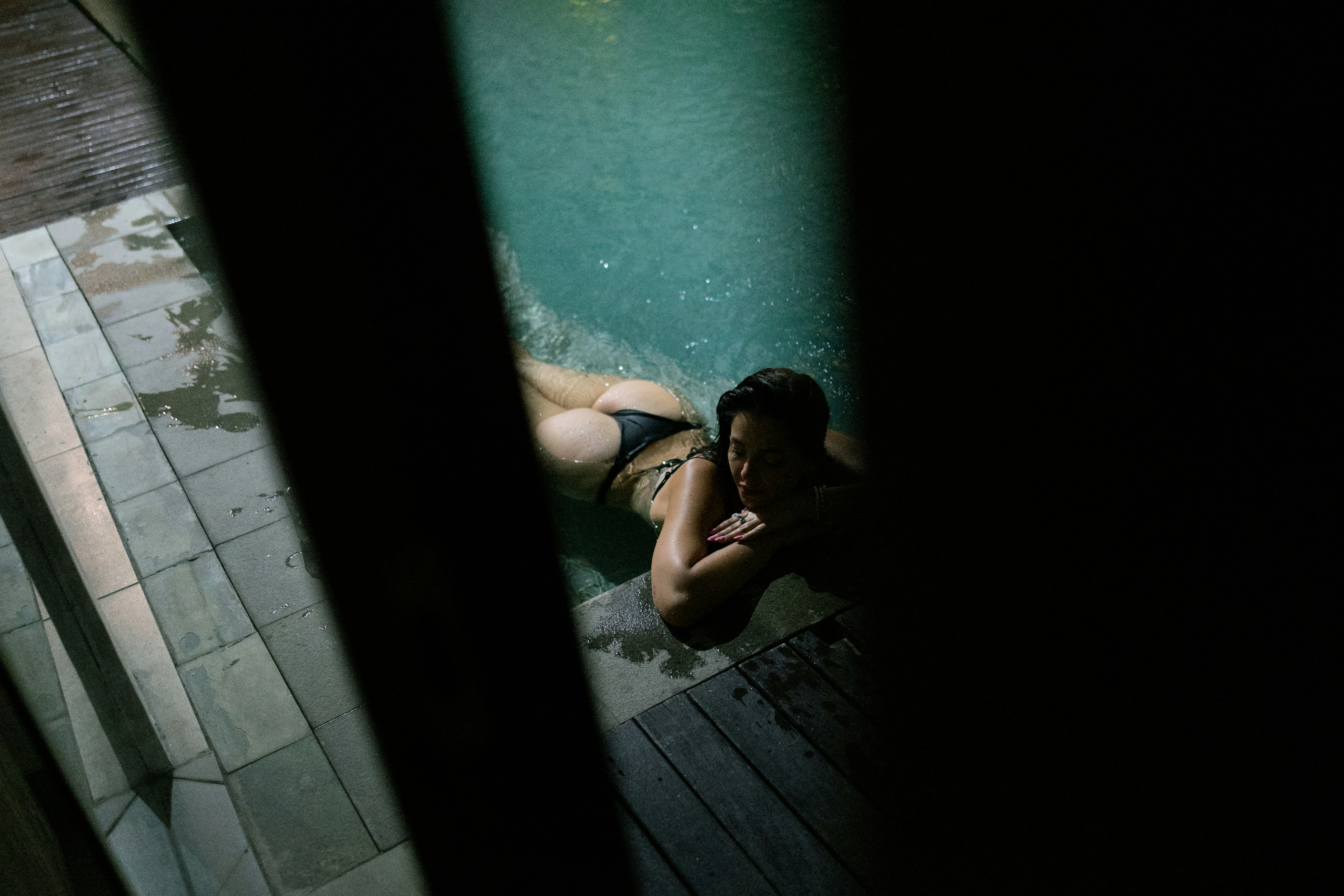 A woman laying down in a swimming pool