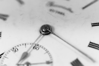 A close up of a watch face with roman numerals