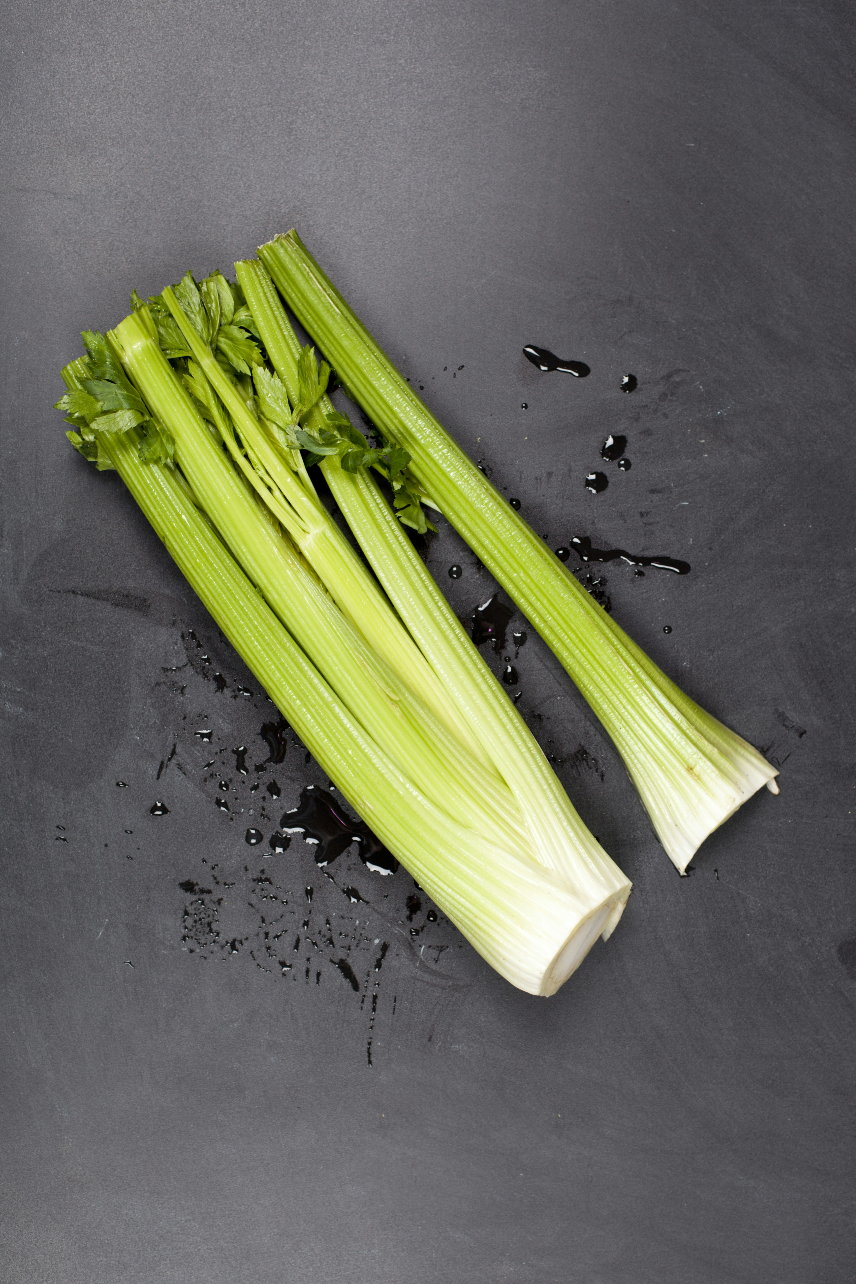 A bunch of celery sitting on top of a table