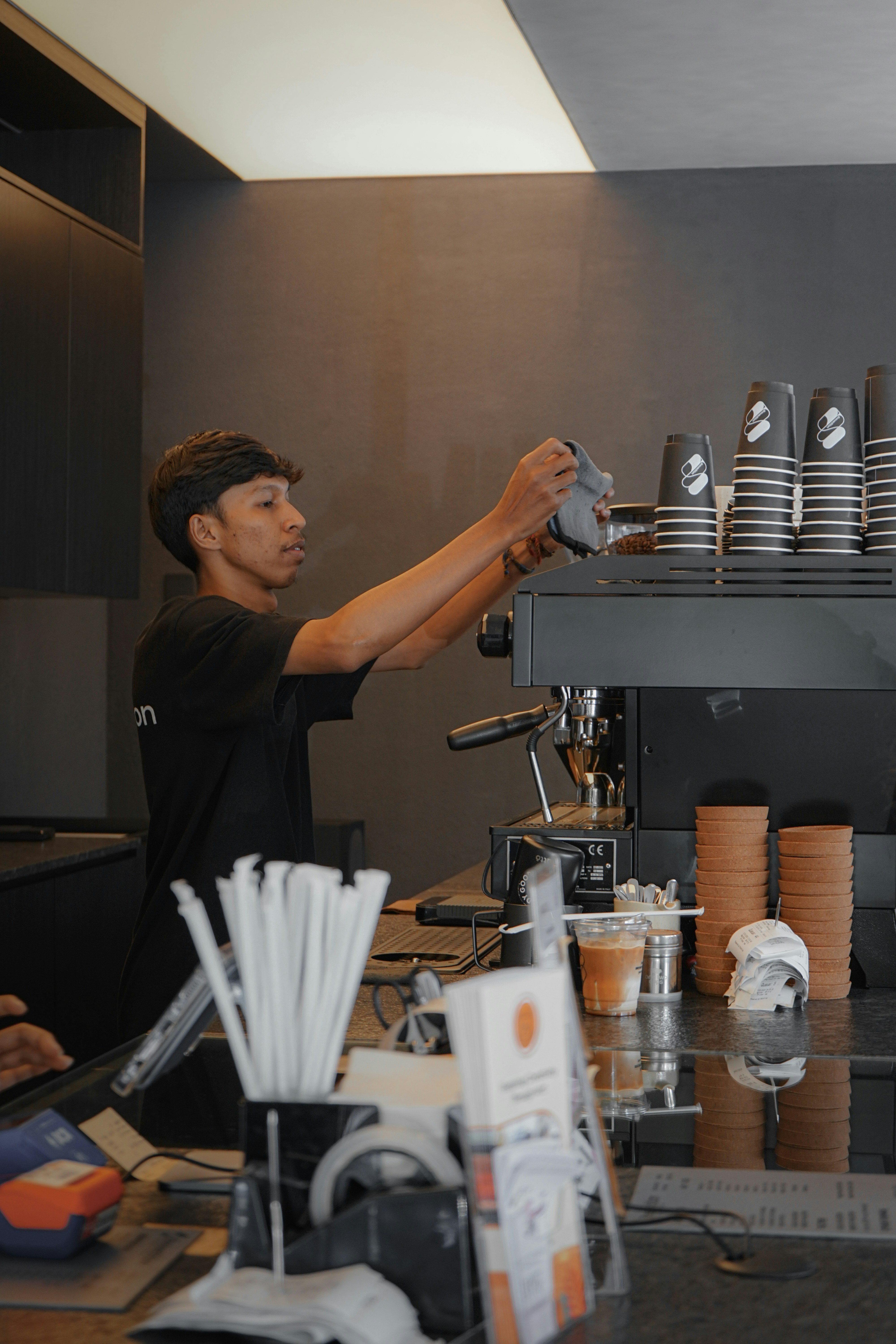 A man is pouring a cup of coffee