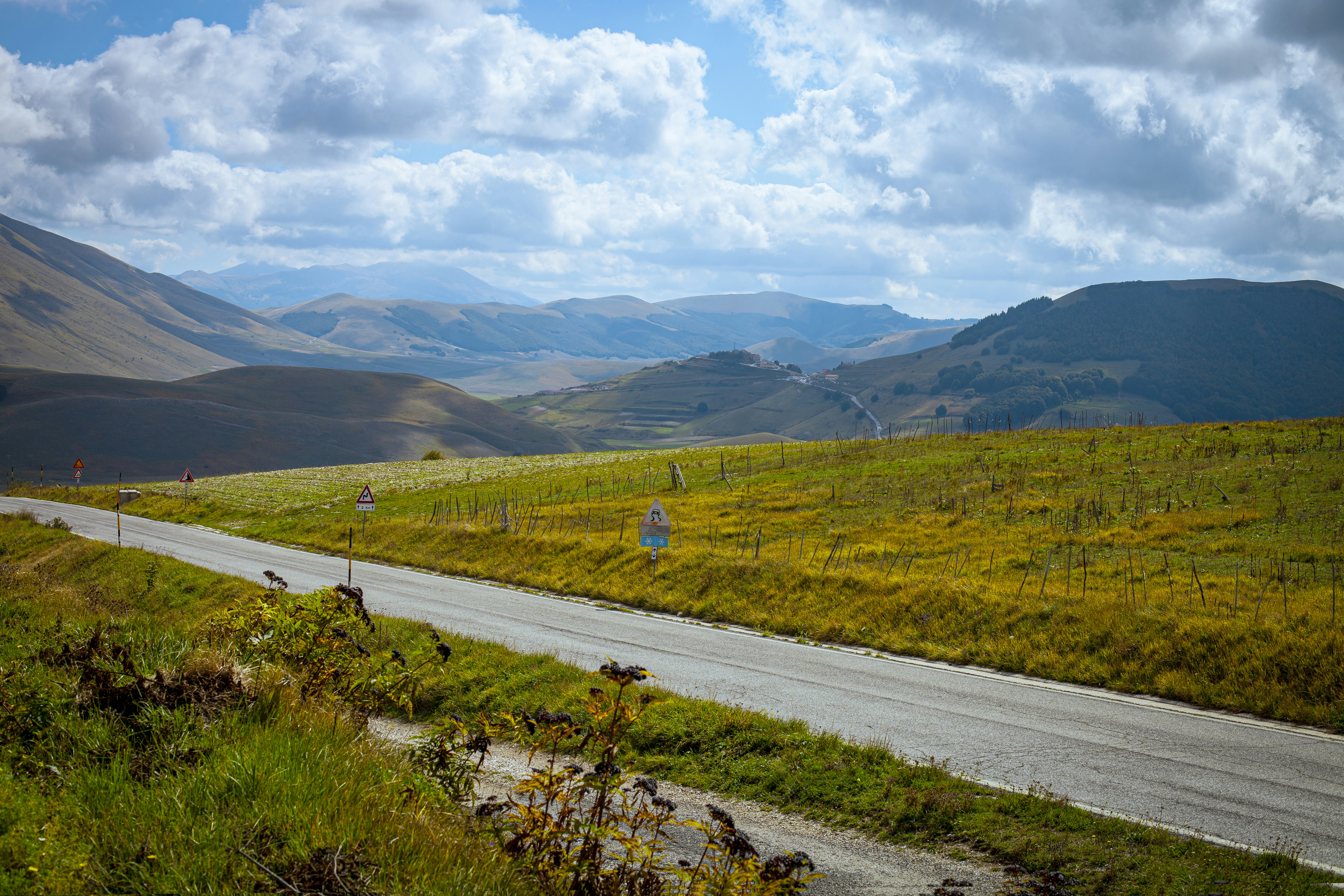 A scenic view of a country road in the mountains