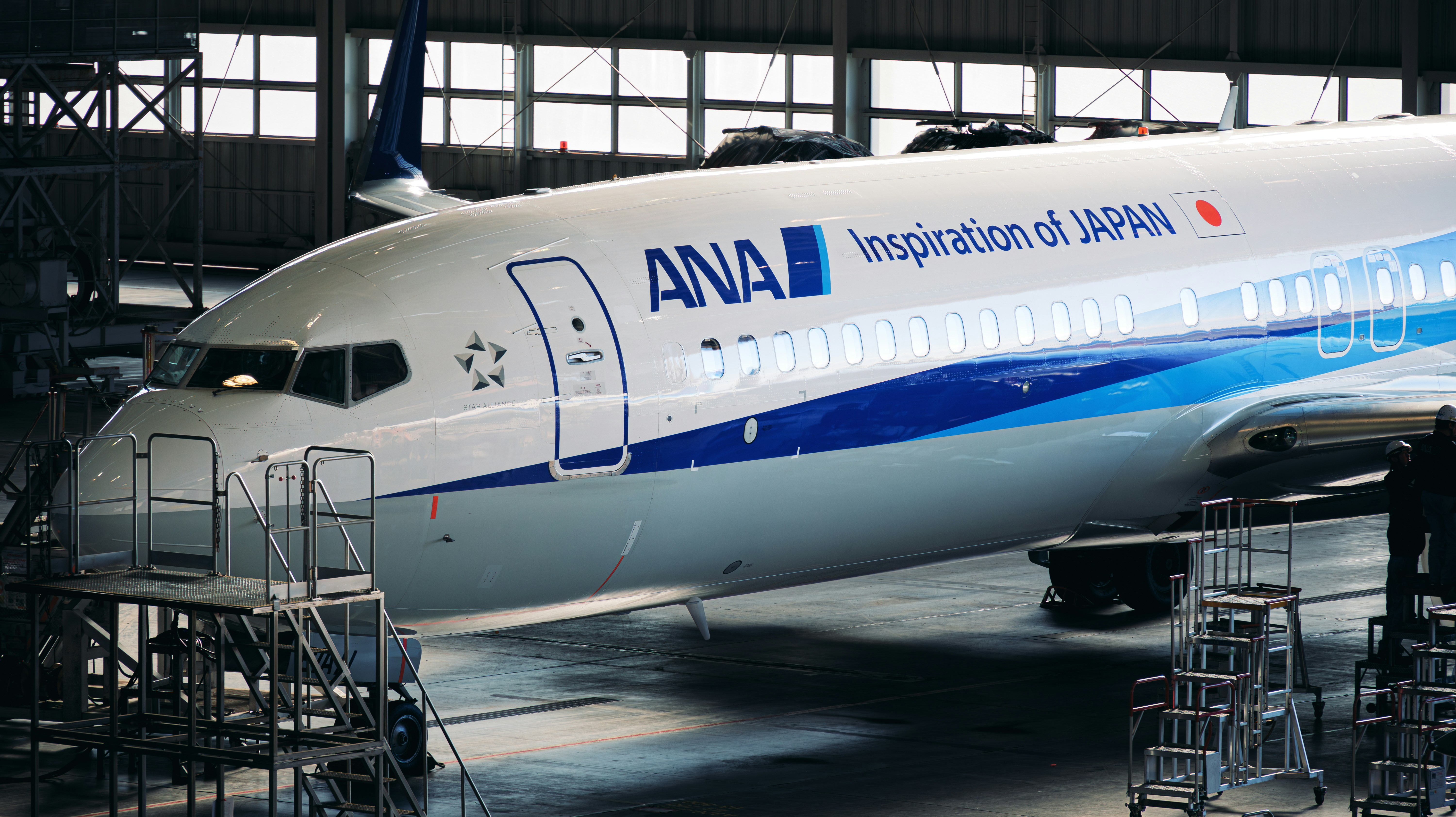A large commercial airplane parked in a hangar