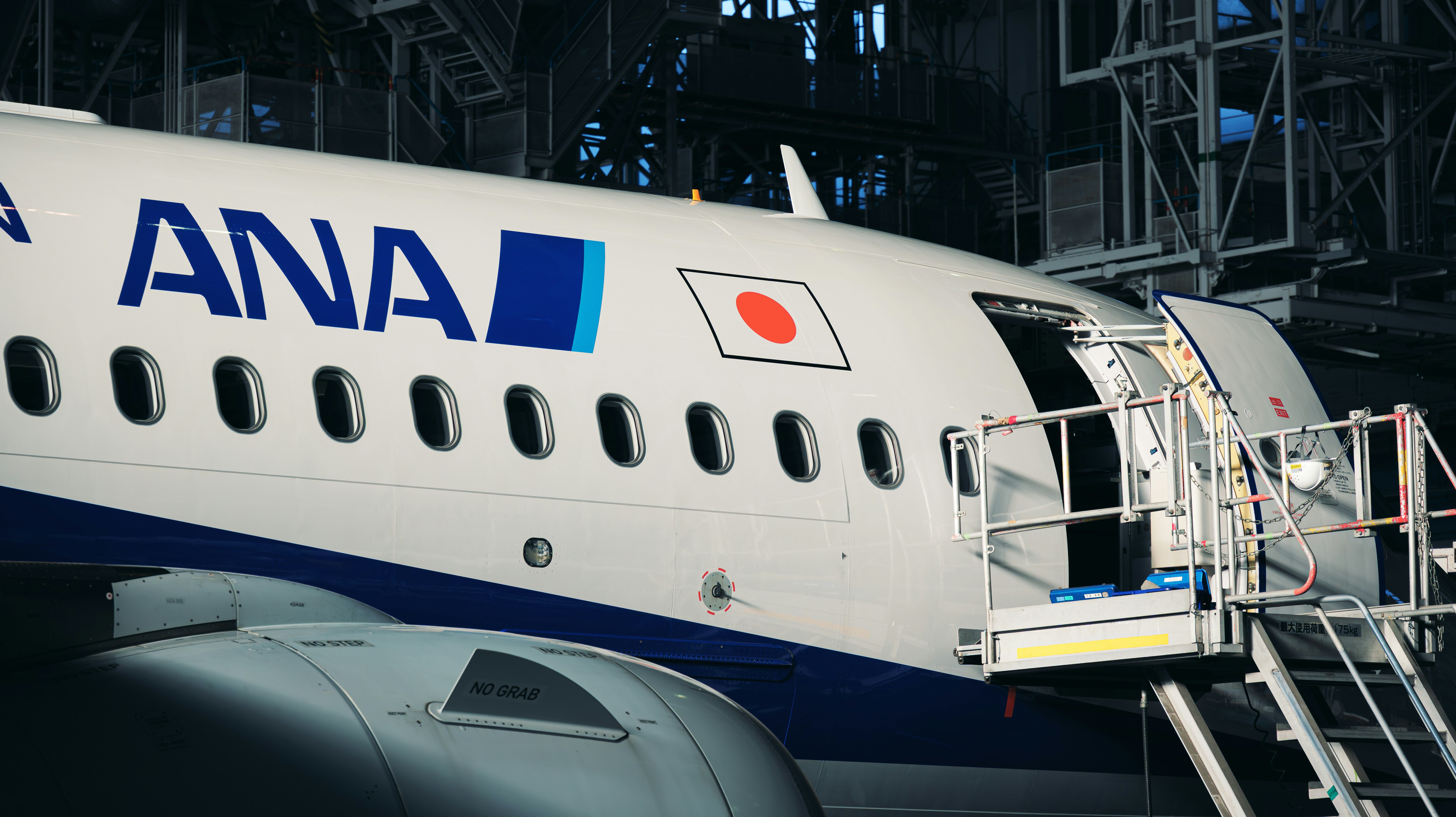 A large commercial airplane parked in a hangar