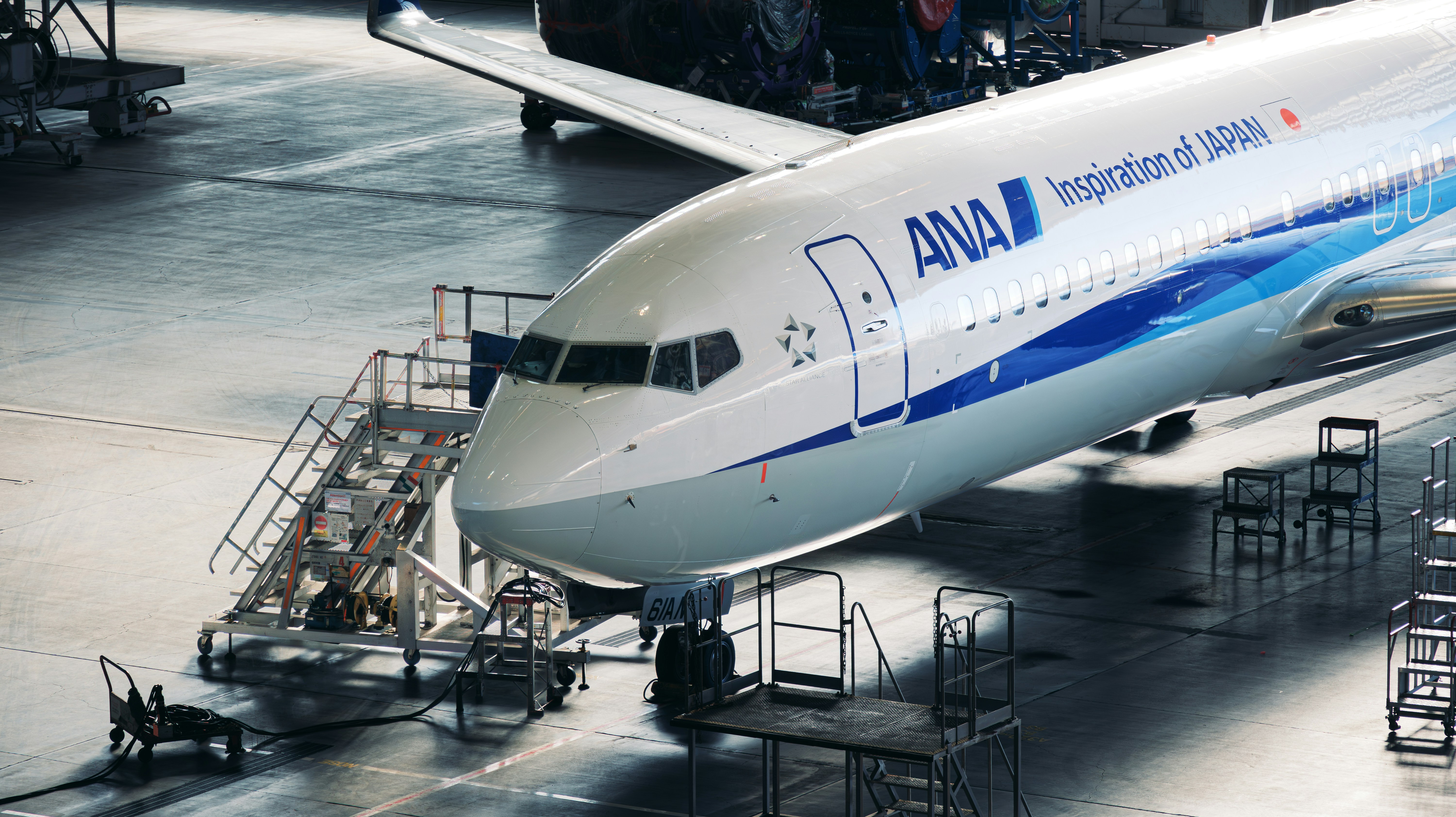 A large jetliner sitting on top of an airport tarmac