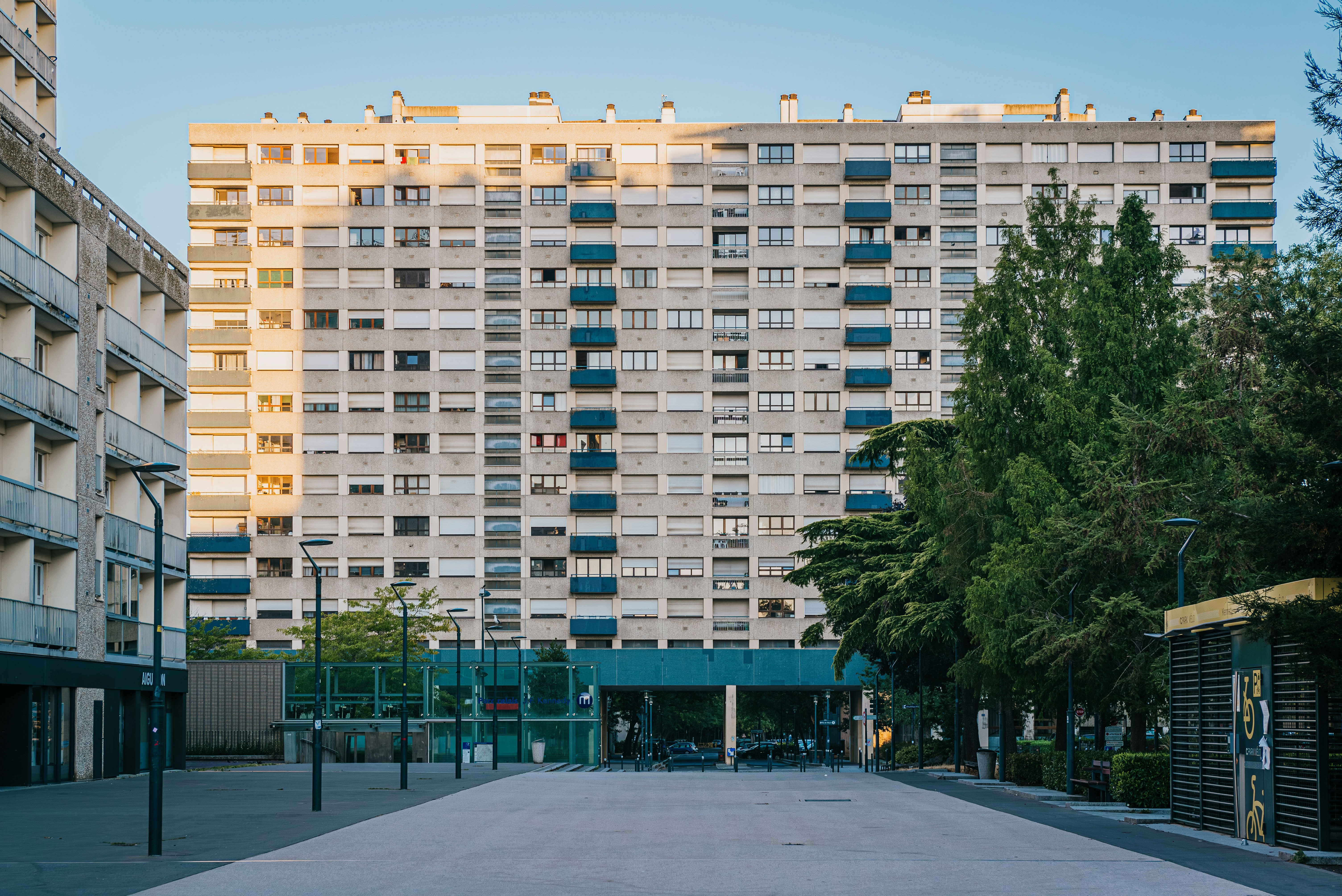 An empty street in front of a tall building