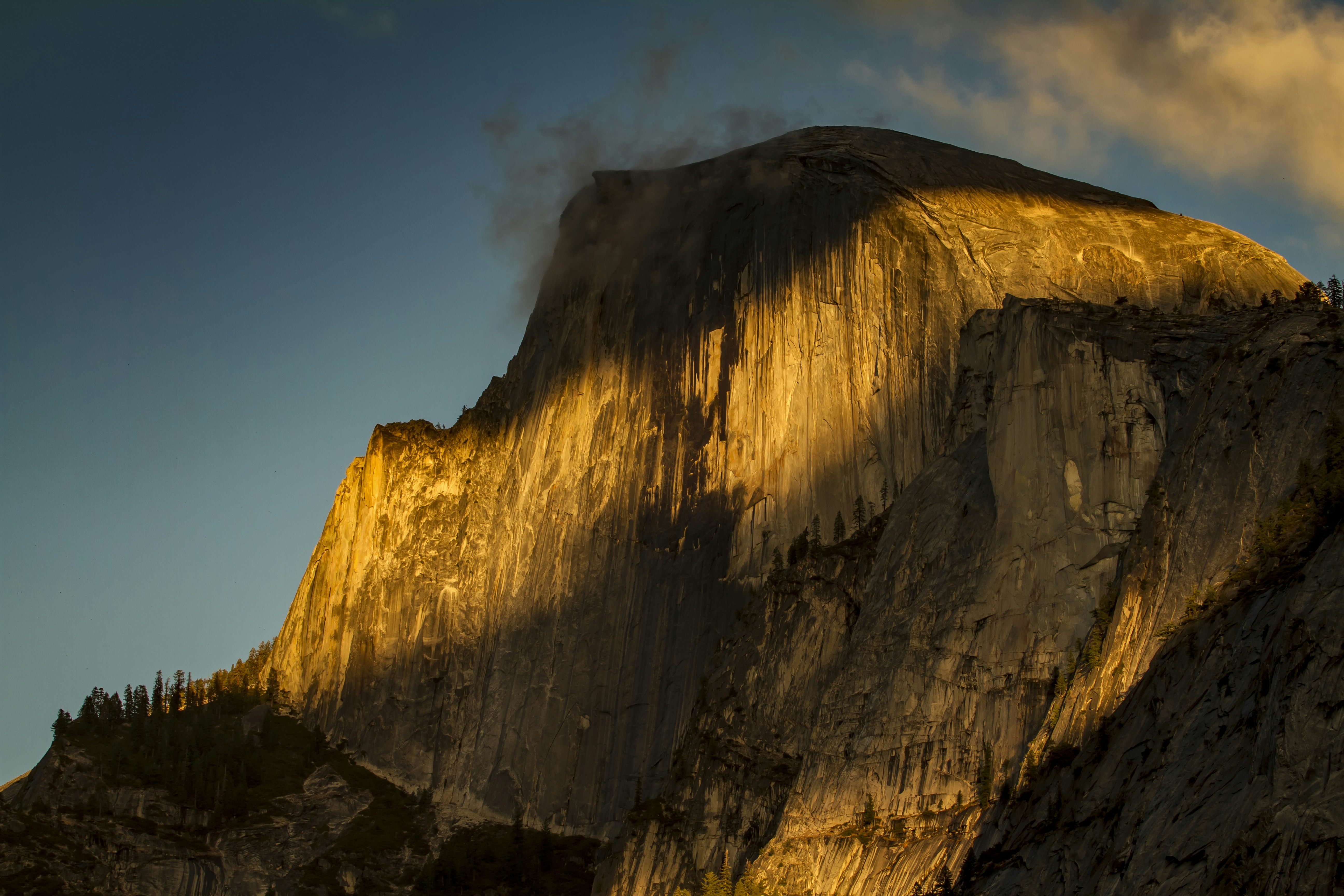 A large mountain with a sky background