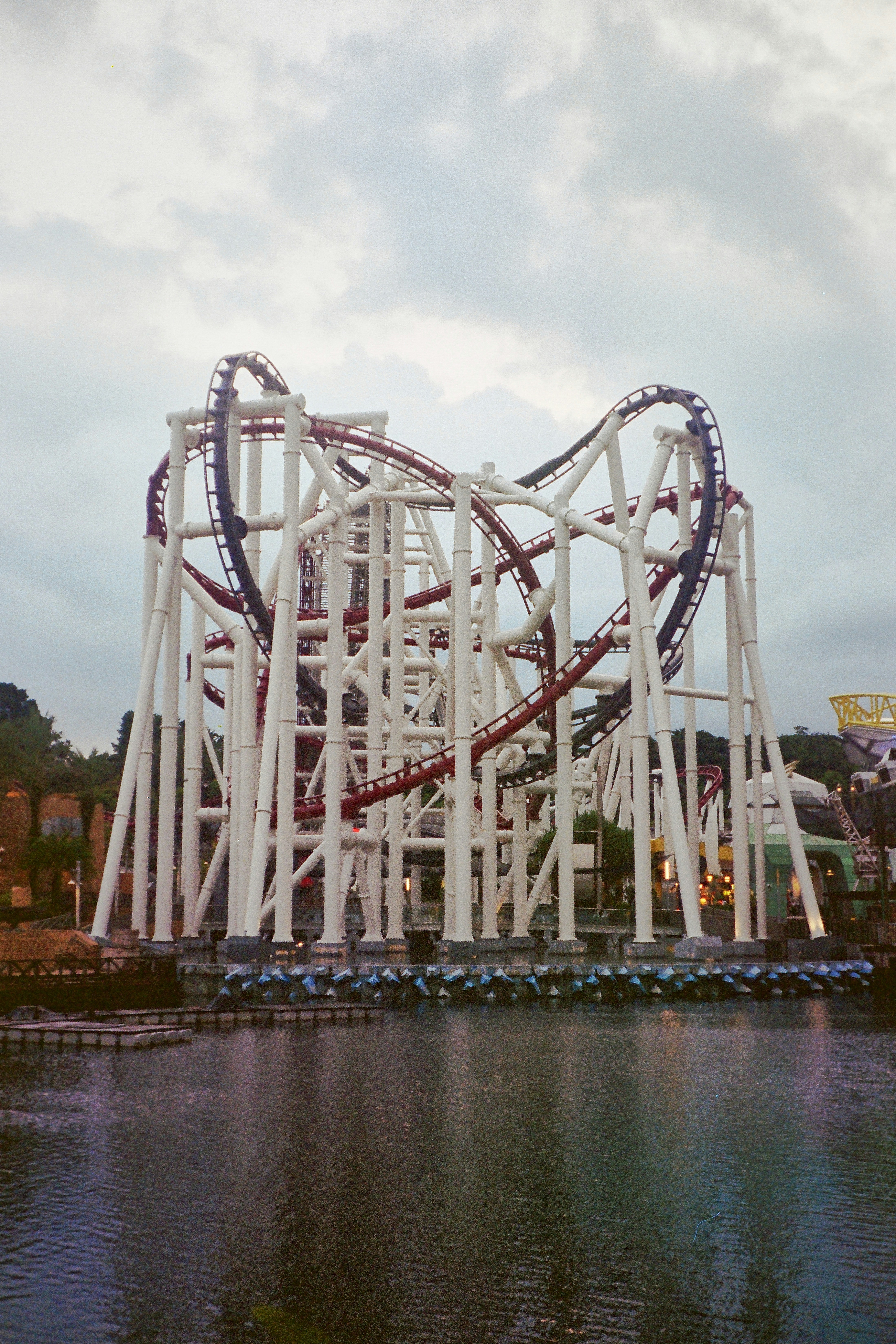 A roller coaster in the middle of a body of water