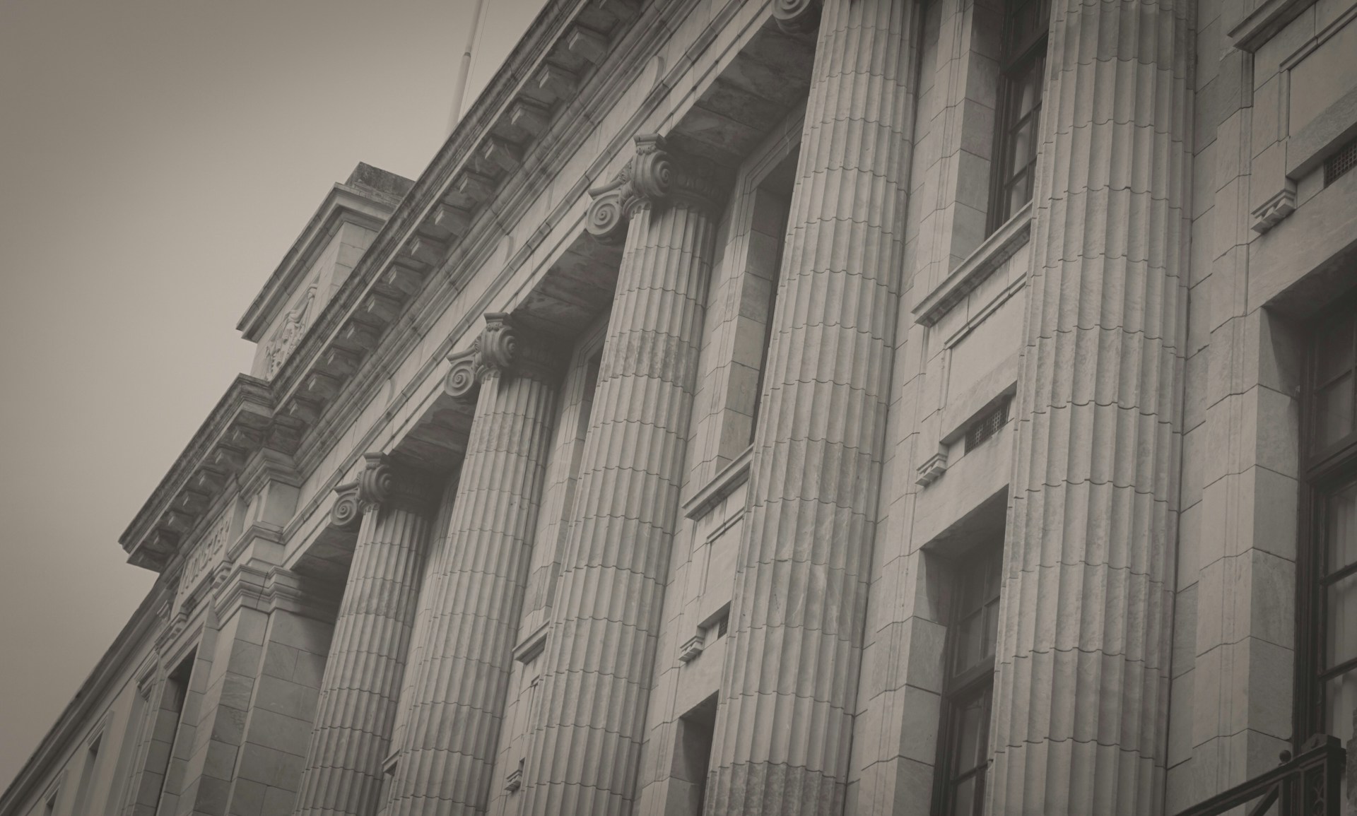 A black and white photo of a tall building