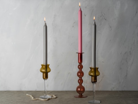 A couple of candles sitting on top of a table