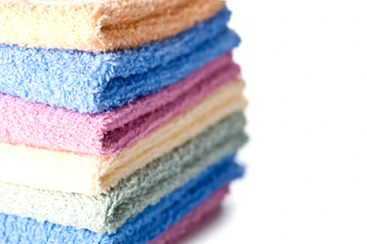 A stack of multicolored towels sitting on top of each other