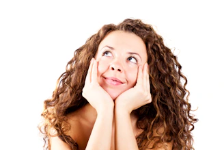 A woman with her hands on her face
