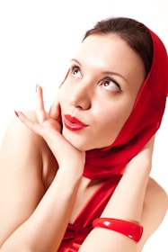 A woman with a red scarf on her head