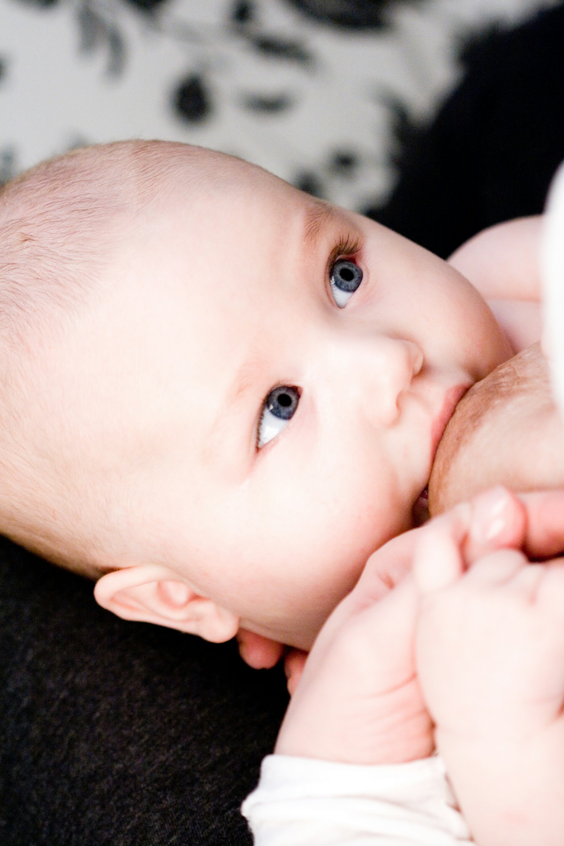 A close up of a person holding a baby
