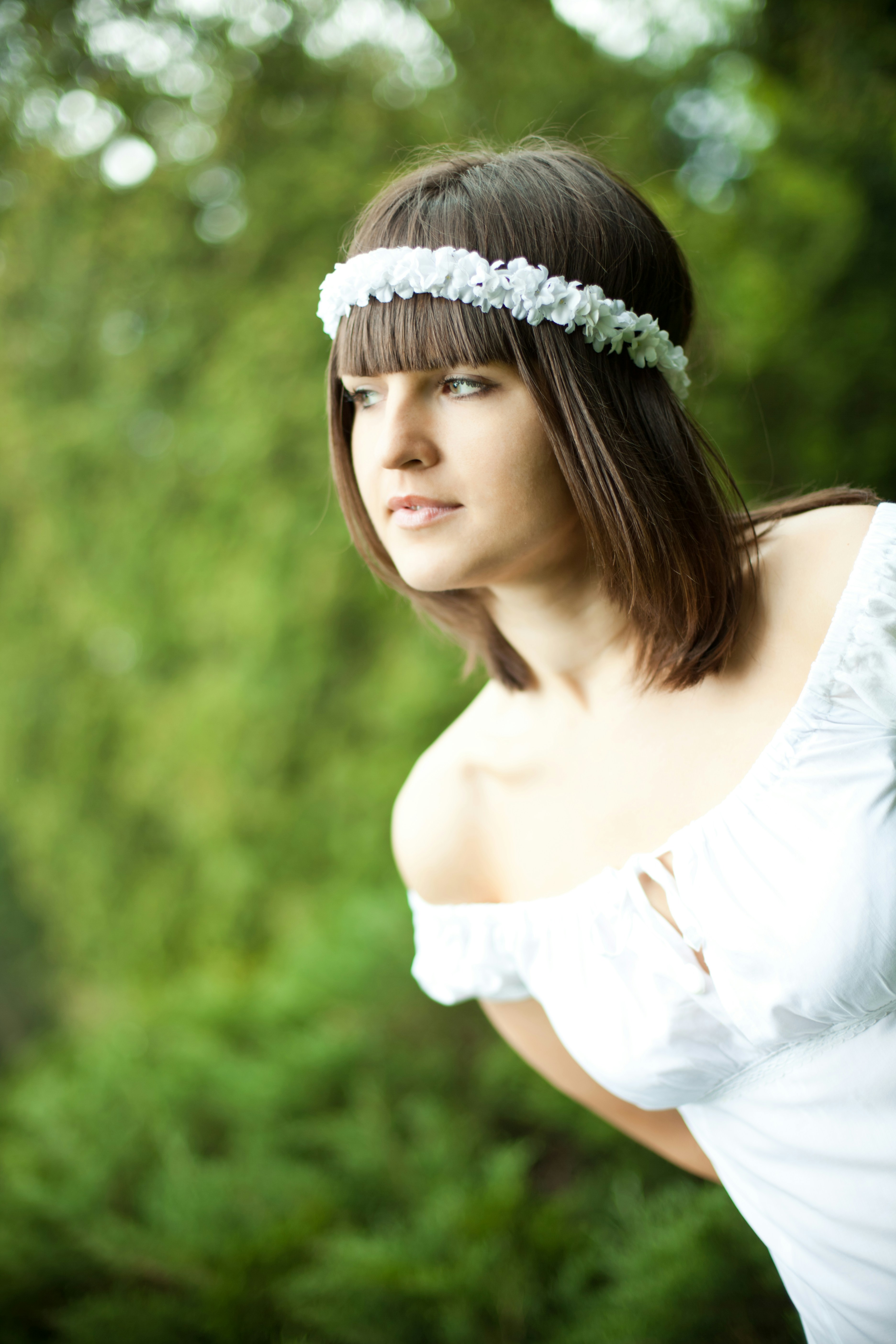 A woman in a white dress posing for a picture photo – Free Face Image ...