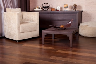 A living room filled with furniture and a wooden floor