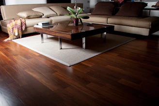 A living room filled with furniture and a wooden floor