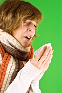 A woman wearing a scarf and a scarf around her neck