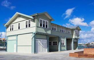 A two story house with a car garage