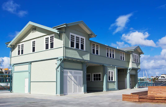 A two story house with a car garage